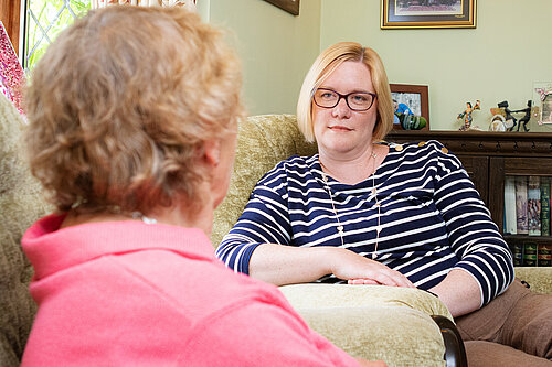 Zöe speaking with older lady